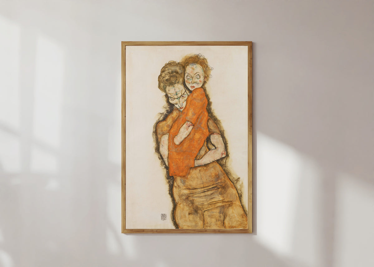 Framed art print of Mother and Child by Egon Schiele, in a light wood frame on a sunlit white wall