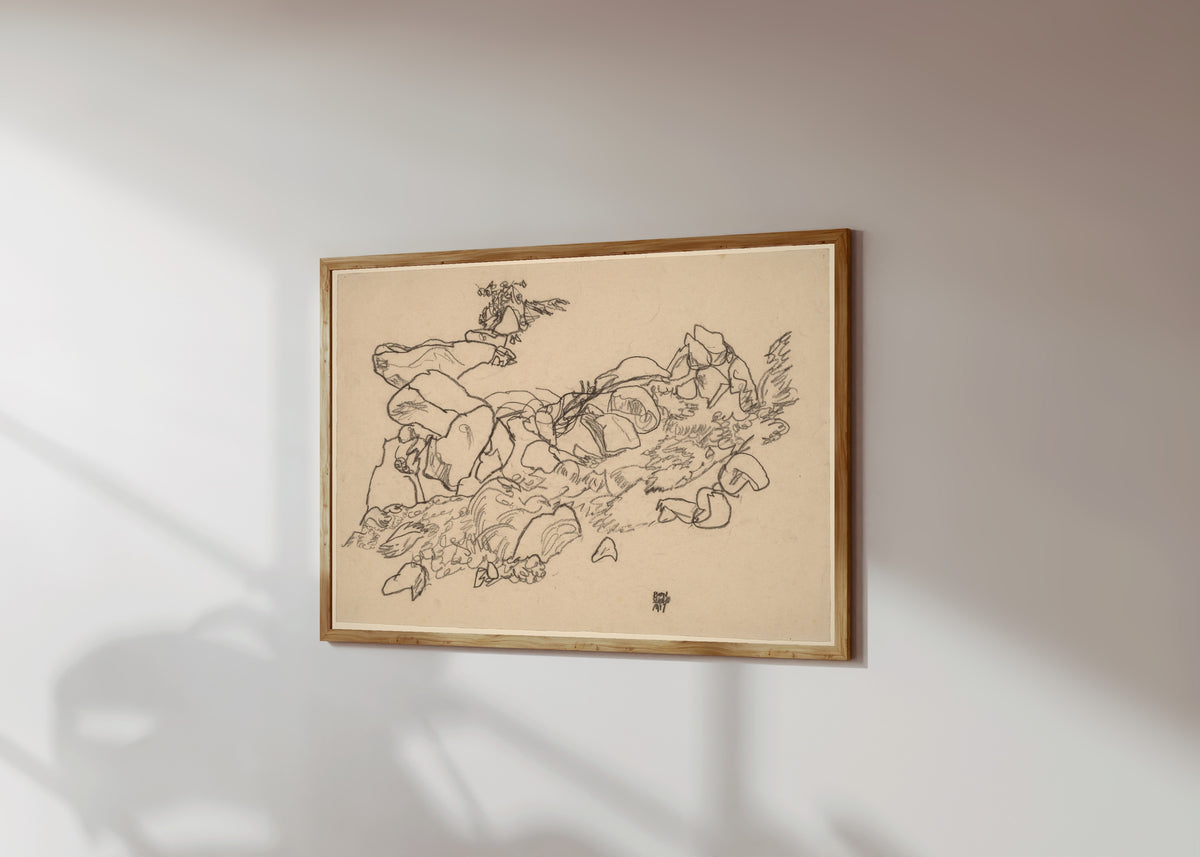 Framed art print of Mountain Stream by Egon Schiele, in a light wood frame on a sunlit white wall, seen at a slight angle