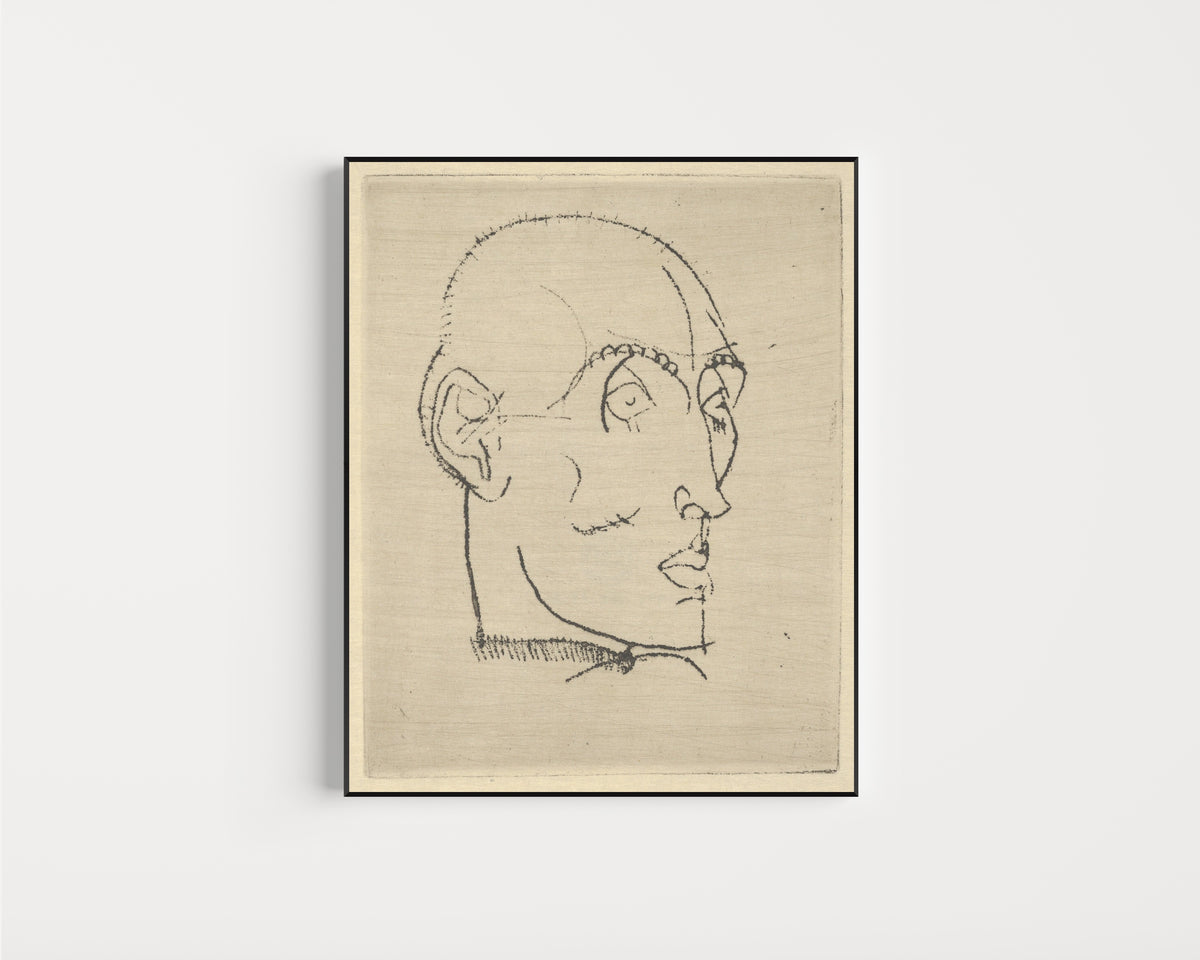 Framed art print of Portrait of a Man by Egon Schiele, in a slim black frame on a plain white wall