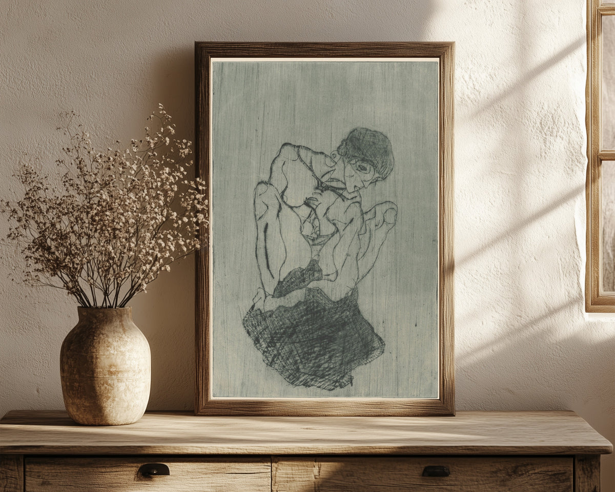 Framed art print of Sorrow (Kümmernis) by Egon Schiele, in a dark wood frame leaning on a rustic console beside dried flowers