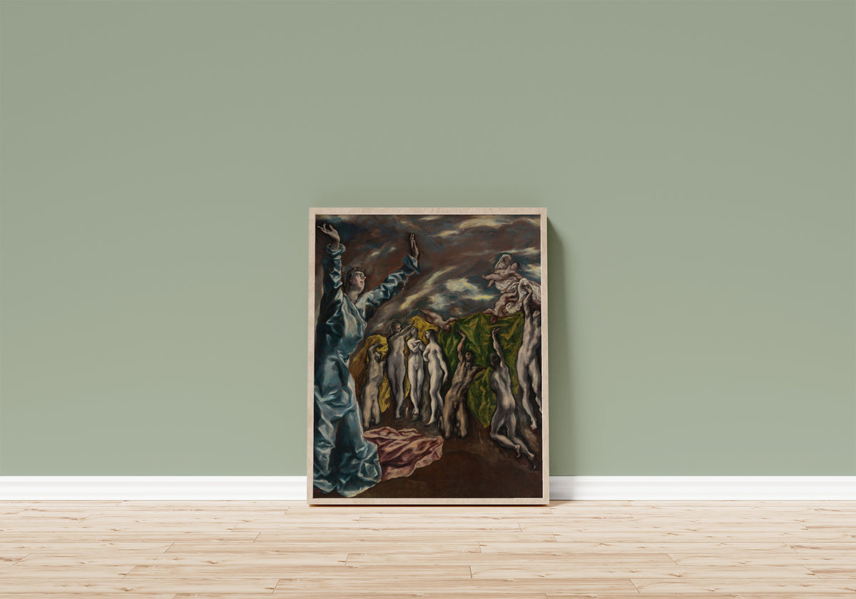 Framed art print of The Vision of Saint John by El Greco, in a light wood frame leaning on a sage green wall above a wooden floor