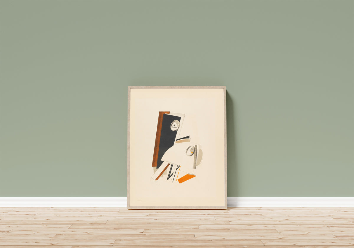Framed art print of Figurines: The Anxious One (Ängstliche) by El Lissitzky, in a light wood frame leaning on a sage green wall above a wooden floor