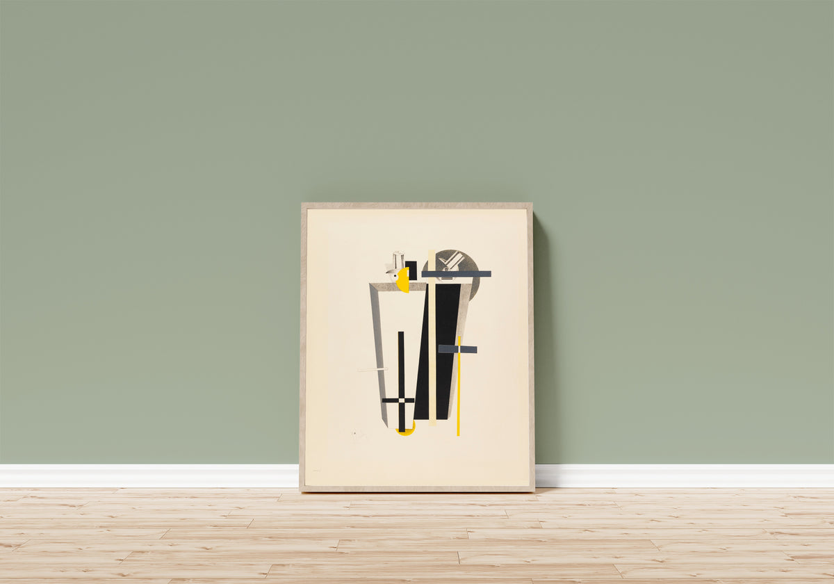 Framed art print of Figurines: The Gravediggers (Totengräber) by El Lissitzky, in a light wood frame leaning on a sage green wall above a wooden floor