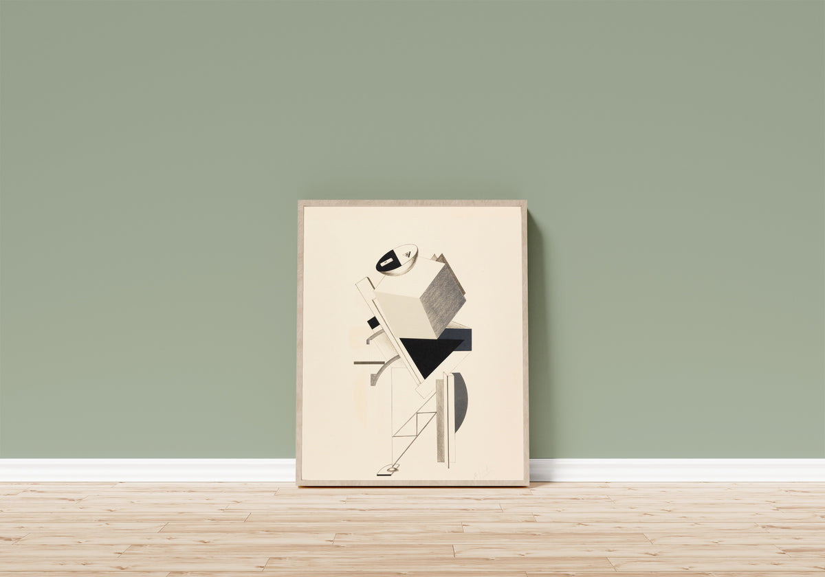 Framed art print of Figurines: The Sentry (Posten) by El Lissitzky, in a light wood frame leaning on a sage green wall above a wooden floor