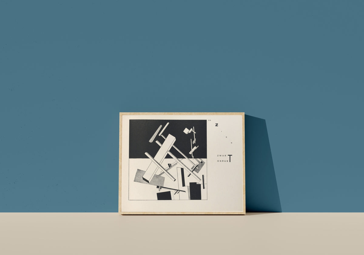 Framed art print of Of Two Squares: Construction 3 (...and See: Black, Turmoil, and...) by El Lissitzky, in a light wood frame leaning on a blue wall