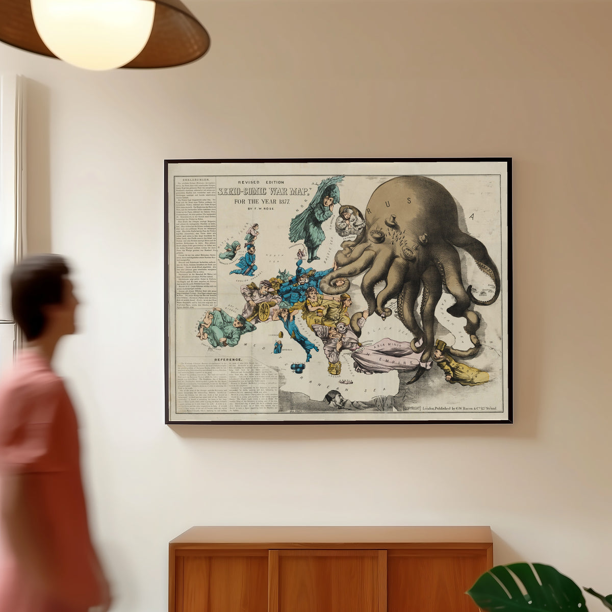 Framed art print of Serio-Comic War Map for the Year 1877 by Frederick W. Rose, in a slim black frame on a warm wall in a sunlit room