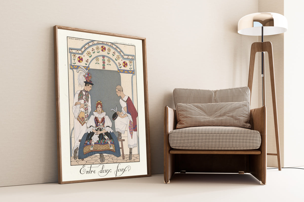 Entre deux feux by George Barbier — framed and leaning against a wall beside an armchair and a floor lamp