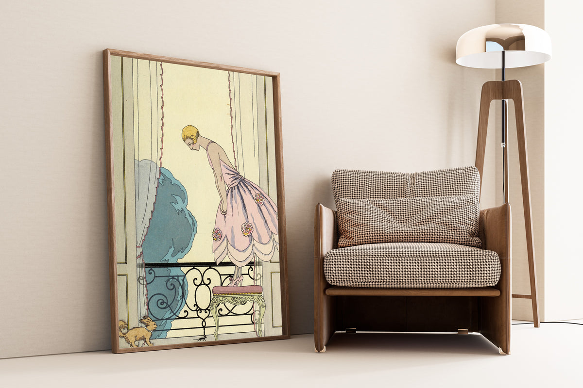 La Souris by George Barbier — framed and leaning against a wall beside an armchair and a floor lamp