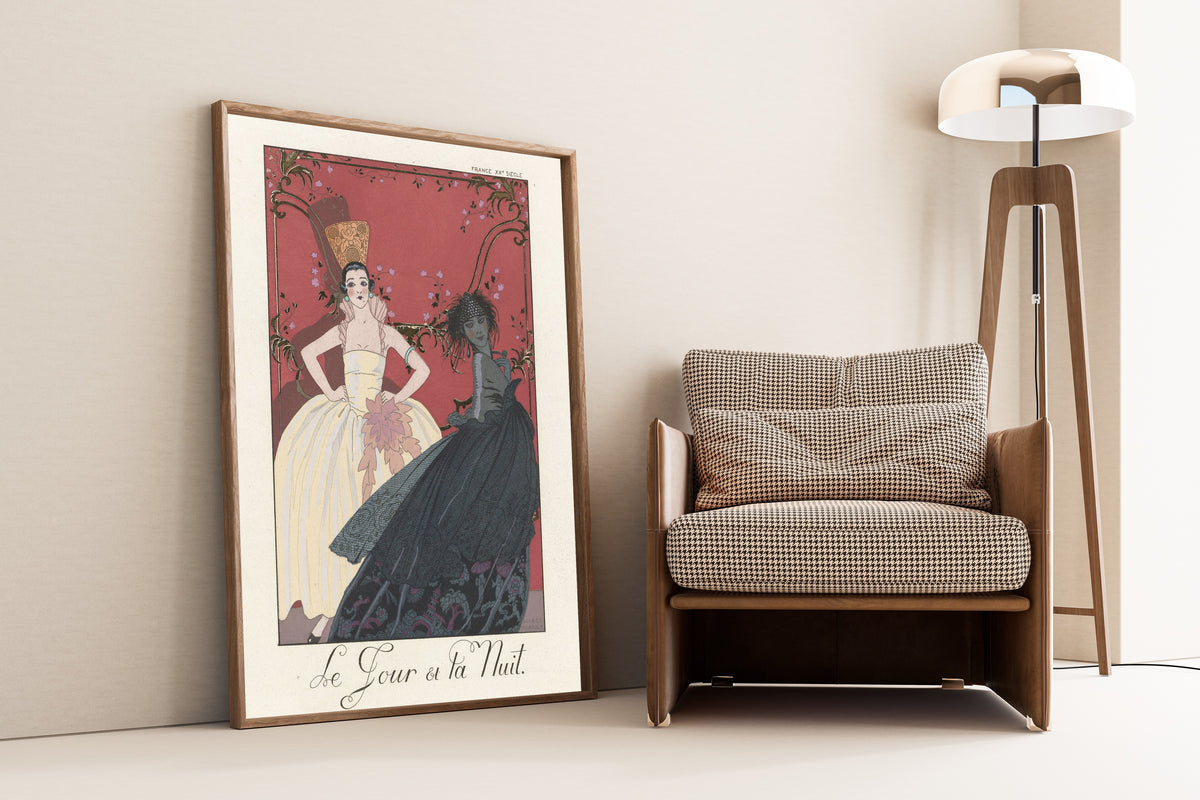 Le Jour et la Nuit by George Barbier — framed and leaning against a wall beside an armchair and a floor lamp