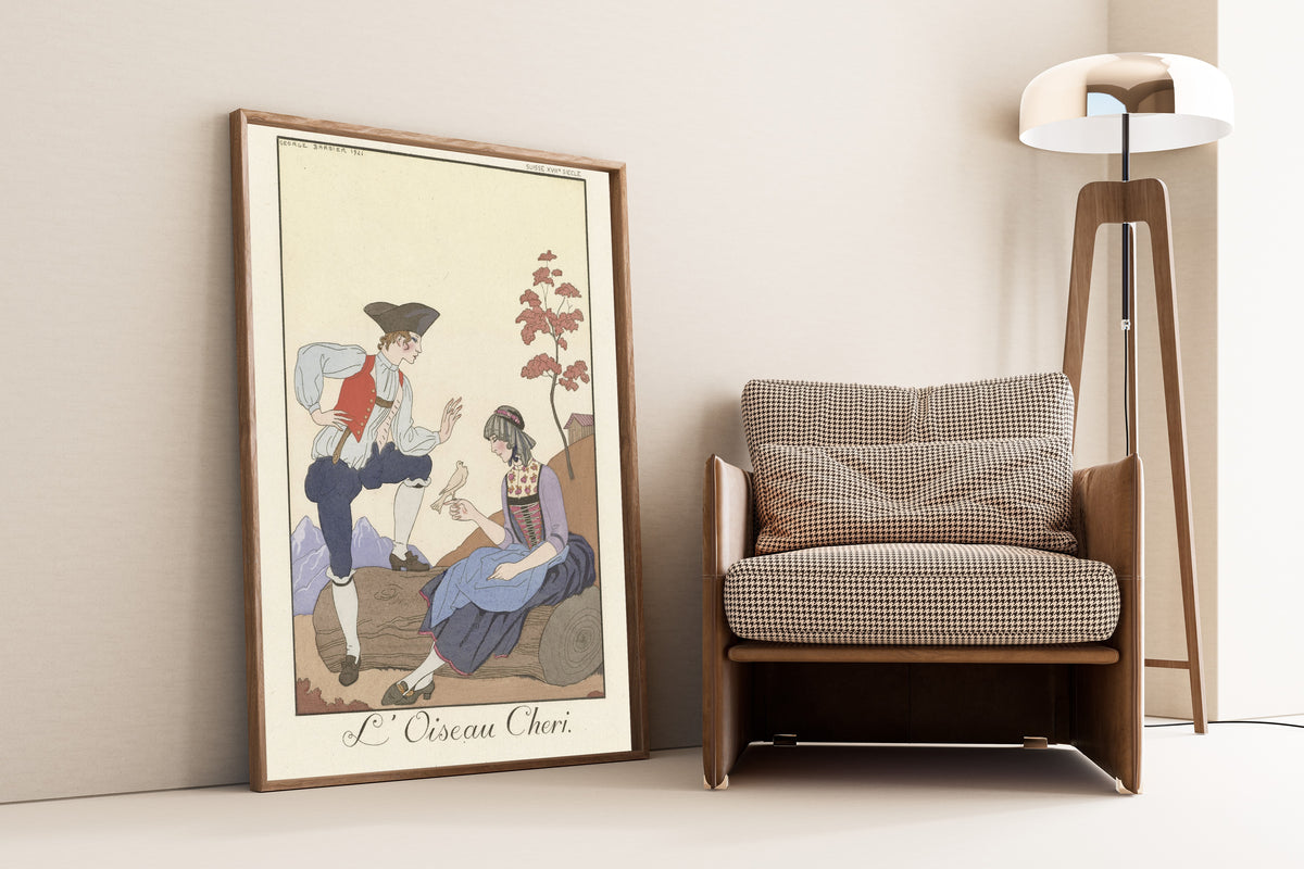 L'Oiseau Chéri by George Barbier — framed and leaning against a wall beside an armchair and a floor lamp