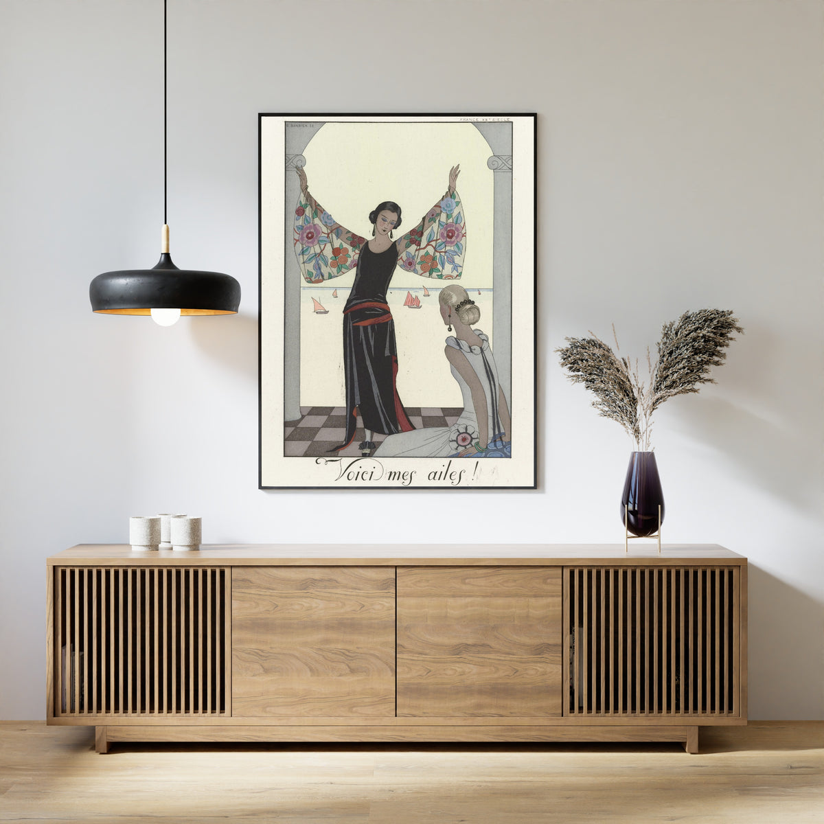 Voici mes ailes! by George Barbier — framed above a slatted wood sideboard