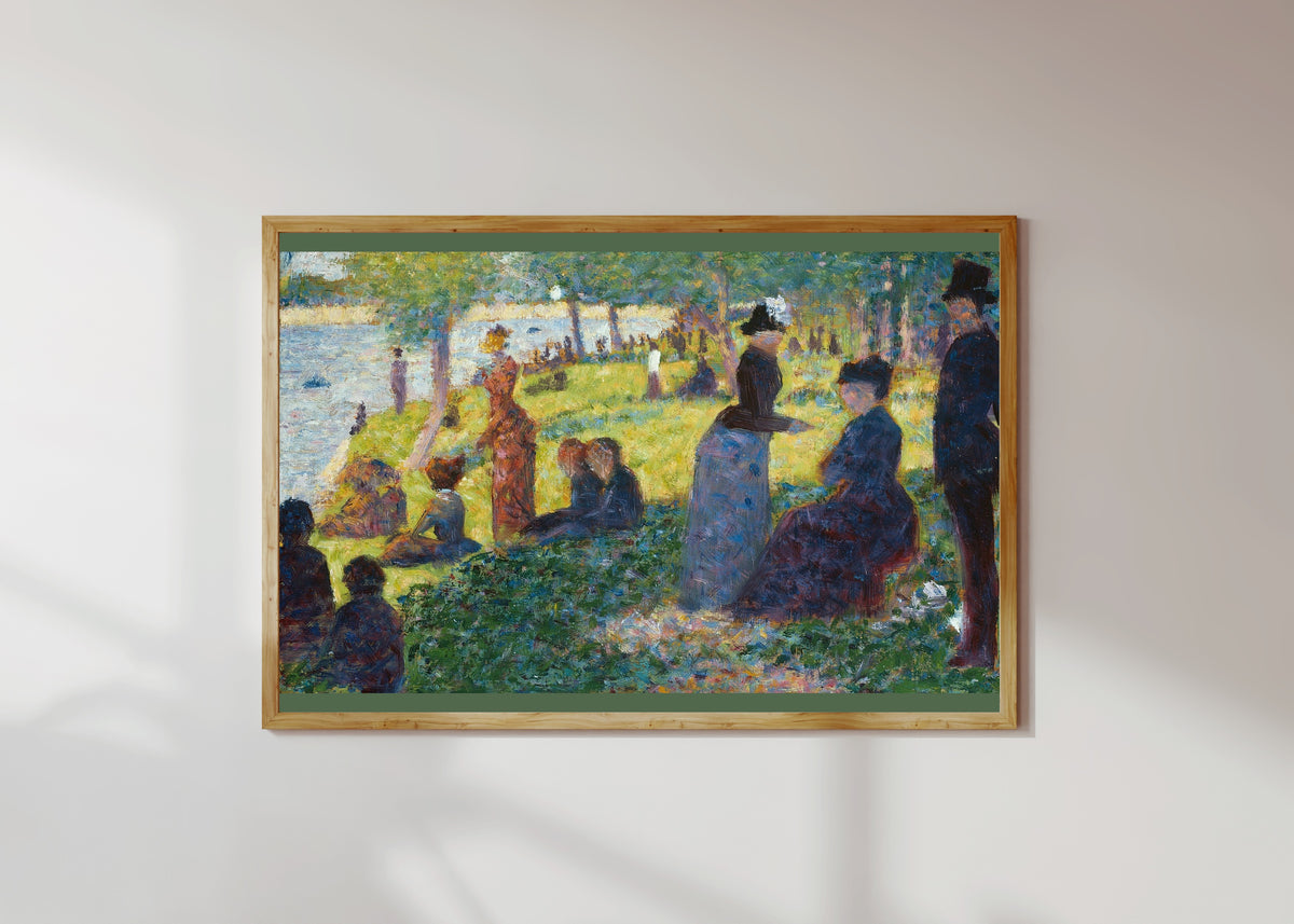 Framed art print of Oil Sketch for A Sunday on La Grande Jatte by Georges Seurat, in a light wood frame on a sunlit white wall