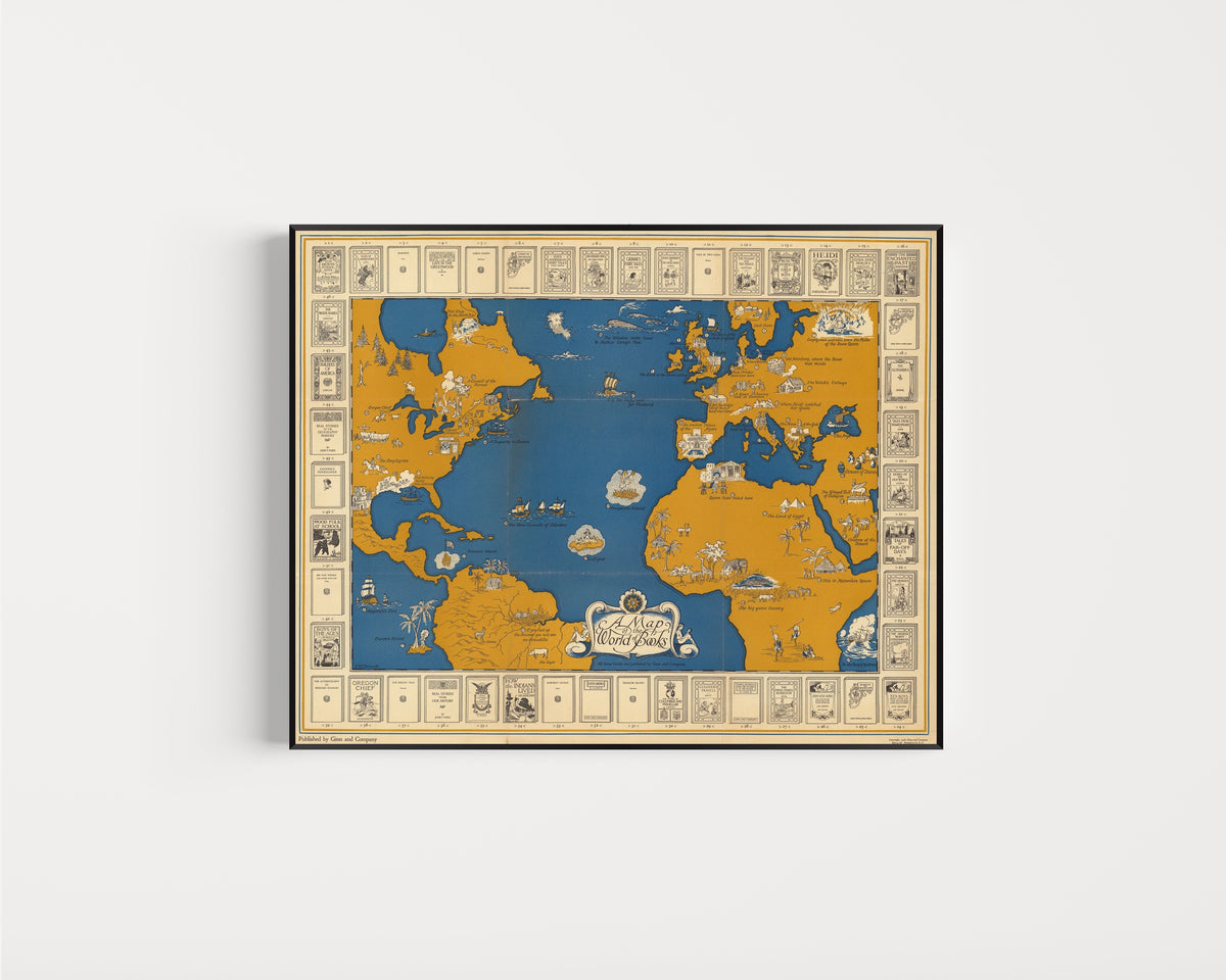 Framed art print of A Map of the World of Books by Ginn and Company, in a slim black frame on a plain white wall