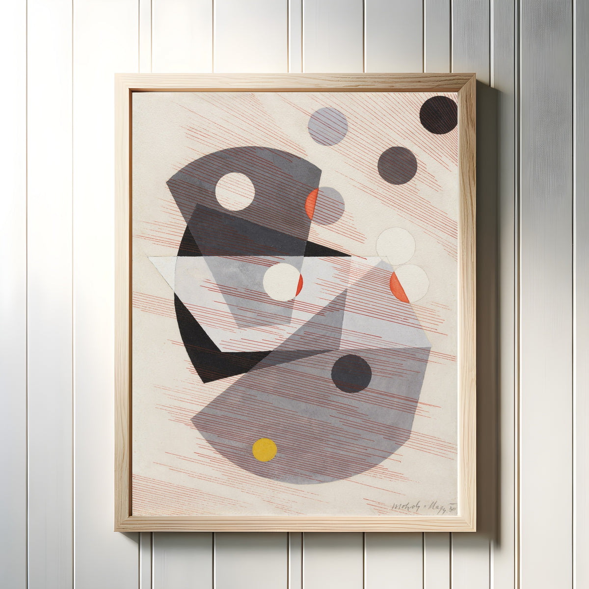 Framed art print of Grey Overlappings by László Moholy-Nagy, in a light wood frame on a white panelled wall