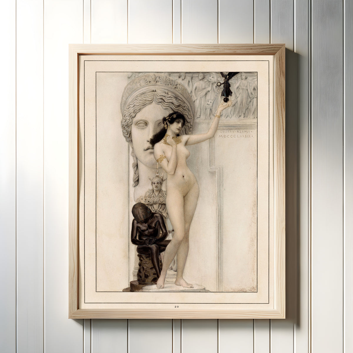 Framed art print of Allegory of Sculpture by Gustav Klimt, in a light wood frame on a white panelled wall