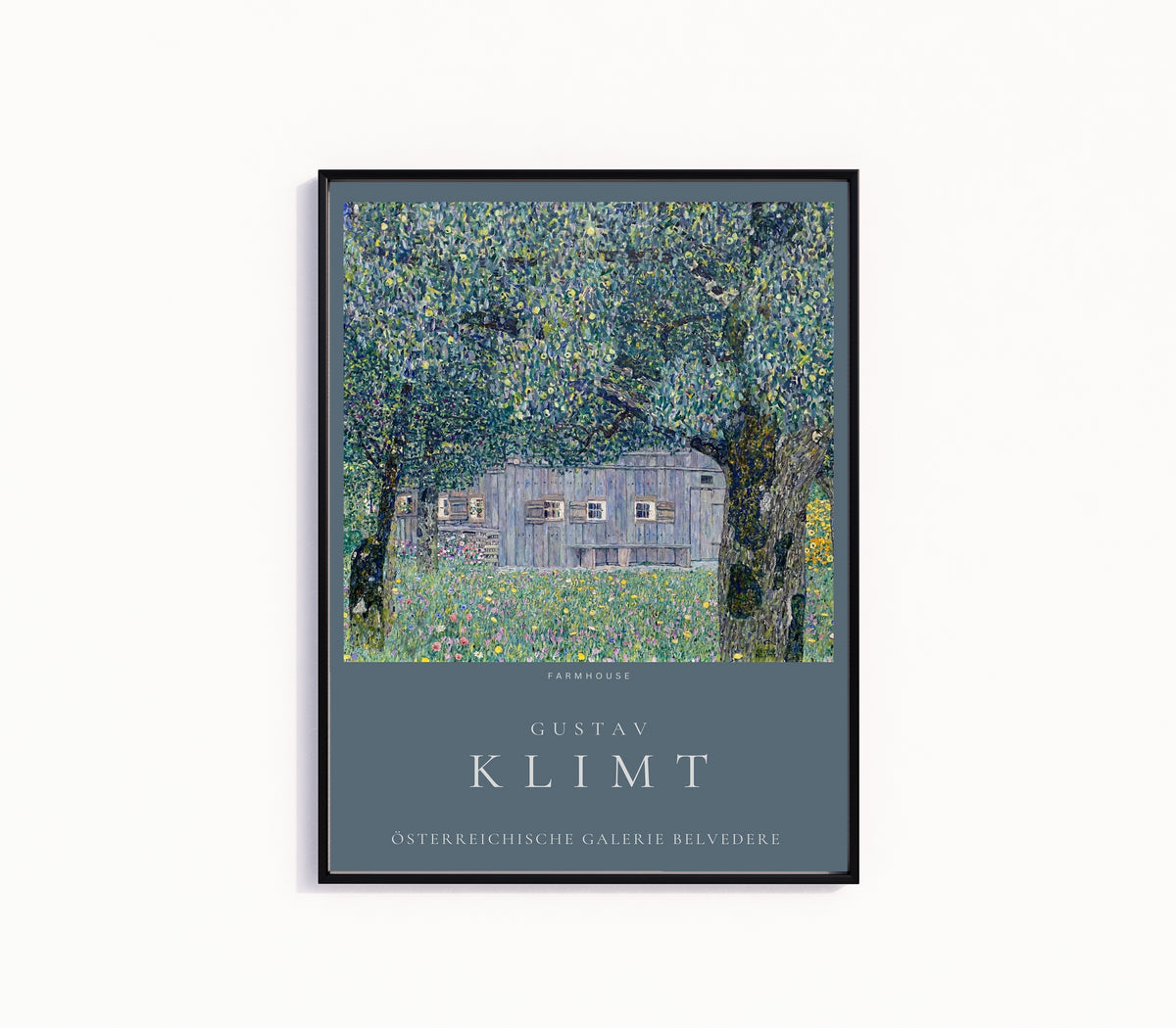 Framed art print of Farmhouse in Upper Austria by Gustav Klimt, in a slim black frame on a plain white wall