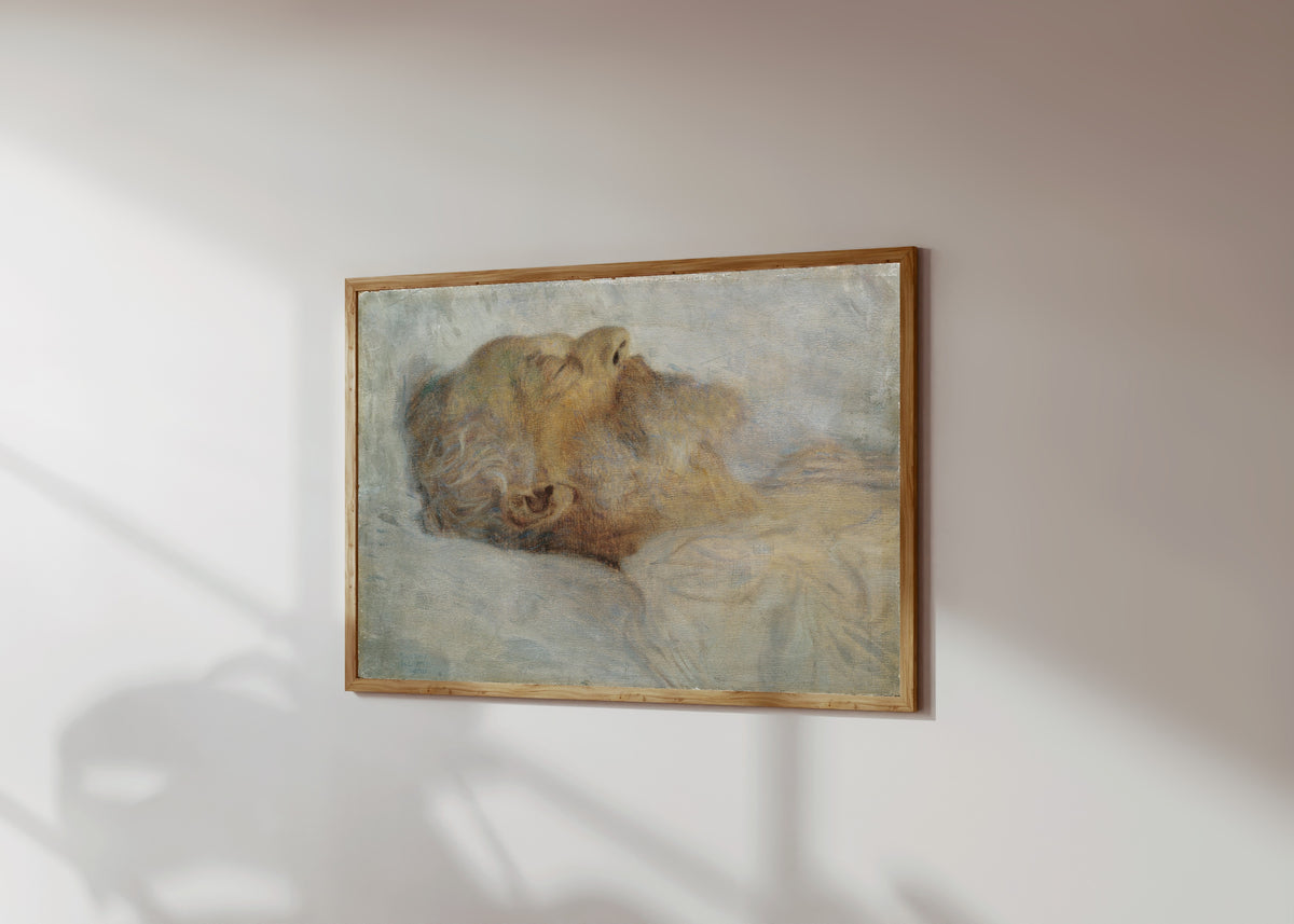 Framed art print of Old Man on his Deathbed (Alter Mann auf dem Totenbett) by Gustav Klimt, in a light wood frame on a sunlit white wall, seen at a slight angle