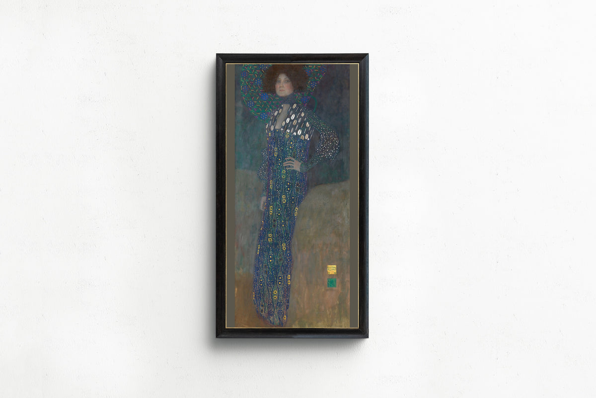 Framed art print of Portrait of Emilie Flöge by Gustav Klimt, in a slim black frame on a plain white wall