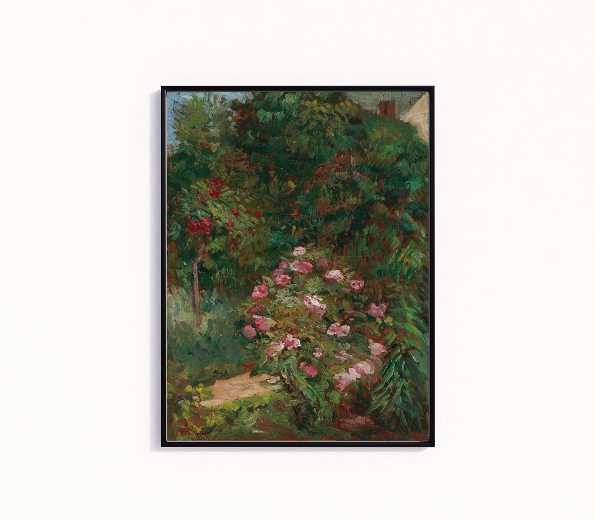 Framed art print of Massif de fleurs, jardin du Petit Gennevilliers by Gustave Caillebotte, in a slim black frame on a plain white wall