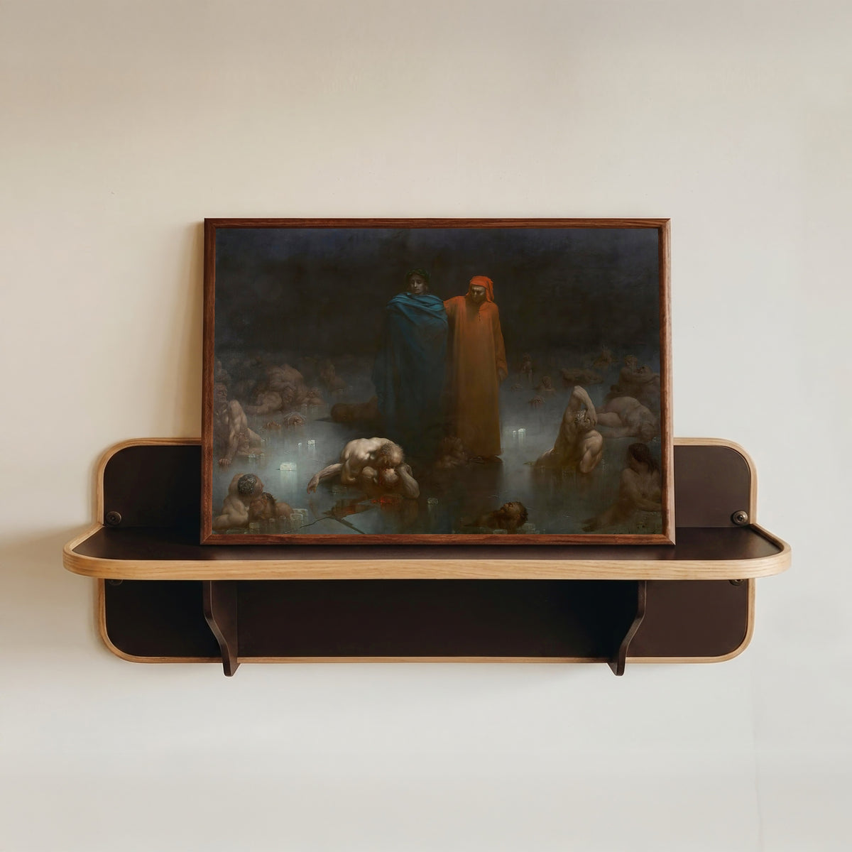 Framed art print of Dante and Virgil in the Ninth Circle of Hell by Gustave Doré, in a dark wood frame resting on a wall shelf