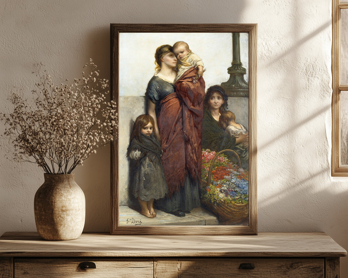 Framed art print of Flower Sellers of London by Gustave Doré, in a dark wood frame leaning on a rustic console beside dried flowers
