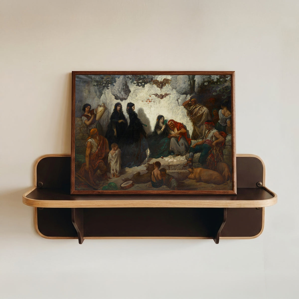 Framed art print of Fortune-Telling at Sacro Monte by Gustave Doré, in a dark wood frame resting on a wall shelf