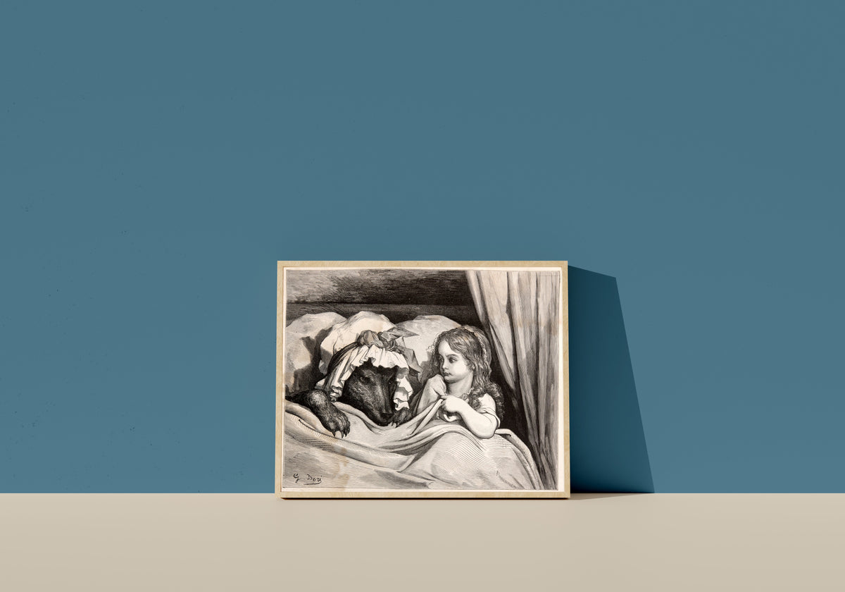 Framed art print of Little Red Riding Hood: In Bed with the Wolf by Gustave Doré, in a light wood frame leaning on a blue wall