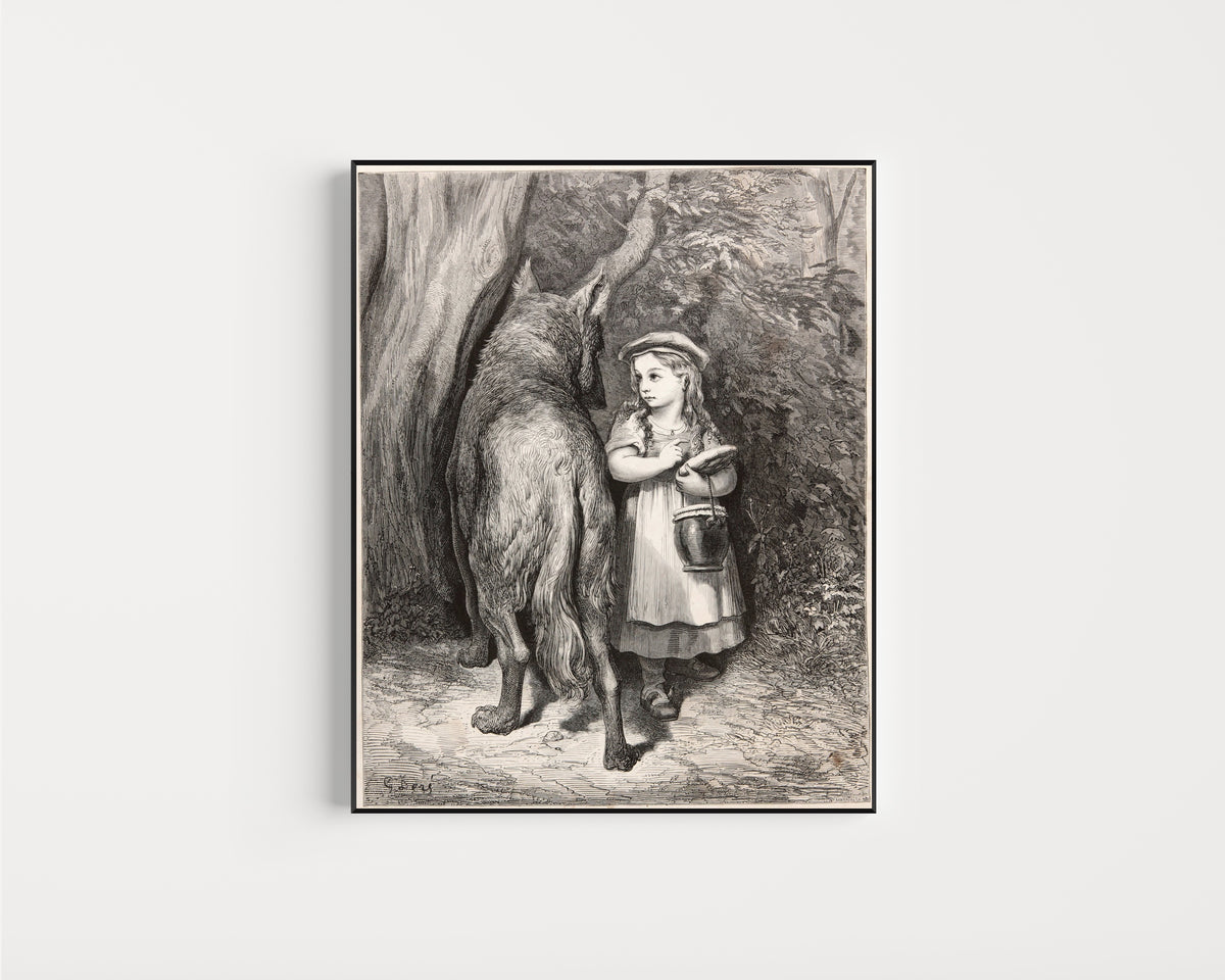 Framed art print of Little Red Riding Hood: Meeting the Wolf by Gustave Doré, in a slim black frame on a plain white wall