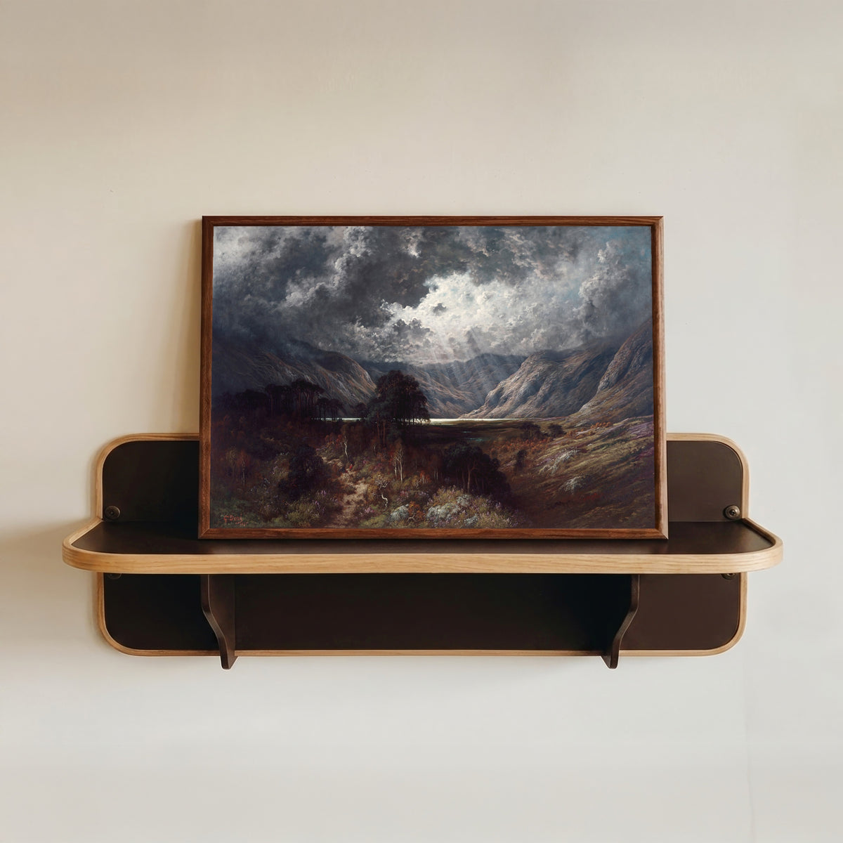 Framed art print of Loch Lomond by Gustave Doré, in a dark wood frame resting on a wall shelf