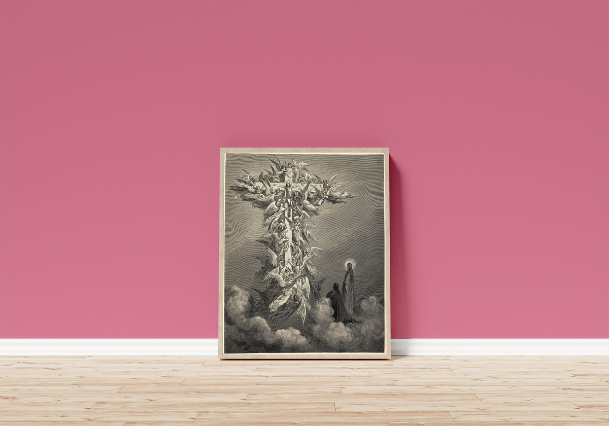 Framed art print of Paradiso, Canto XIV: The Cross of Mars by Gustave Doré, in a light wood frame leaning on a pink wall above a wooden floor