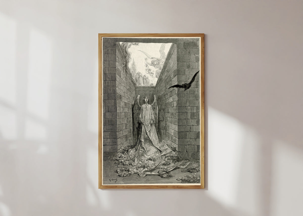 Framed art print of Sorrow for the lost Lenore by Gustave Doré, in a light wood frame on a sunlit white wall