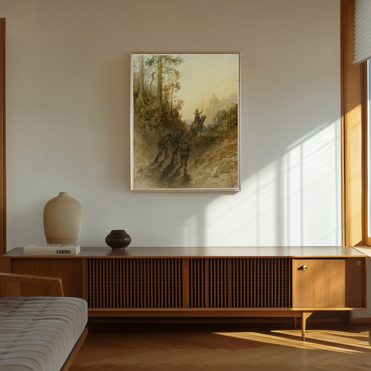 Framed art print of The Giants are Captured by Gustave Doré, in a thin light frame on a sunlit wall above a wooden sideboard