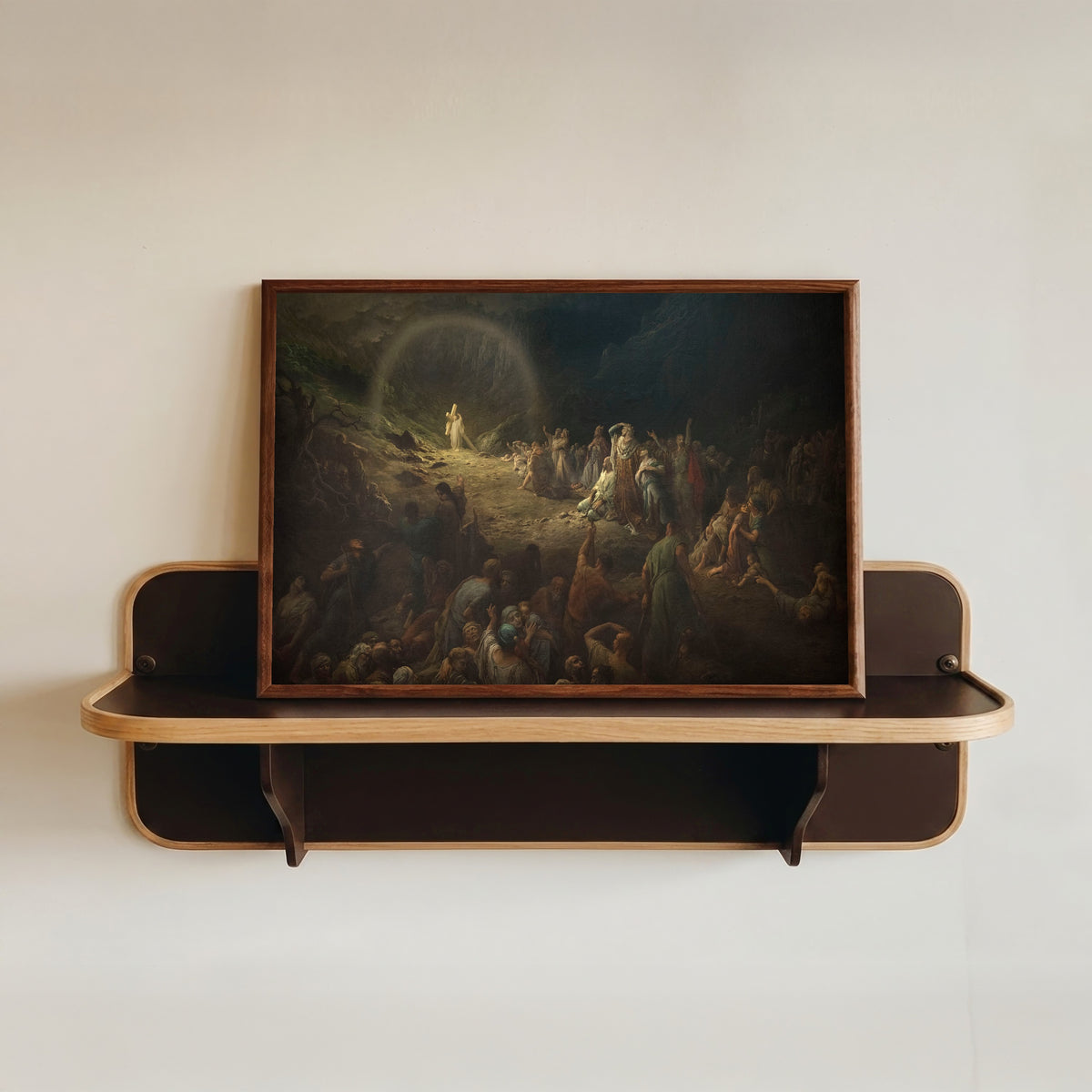 Framed art print of The Vale of Tears (La Vallée des larmes) by Gustave Doré, in a dark wood frame resting on a wall shelf