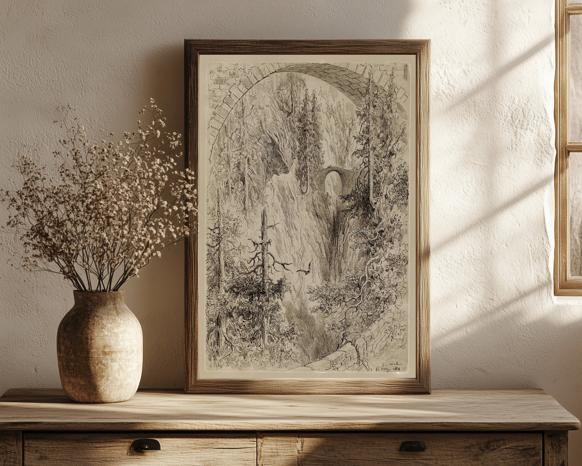 Framed art print of Via Mala by Gustave Doré, in a dark wood frame leaning on a rustic console beside dried flowers
