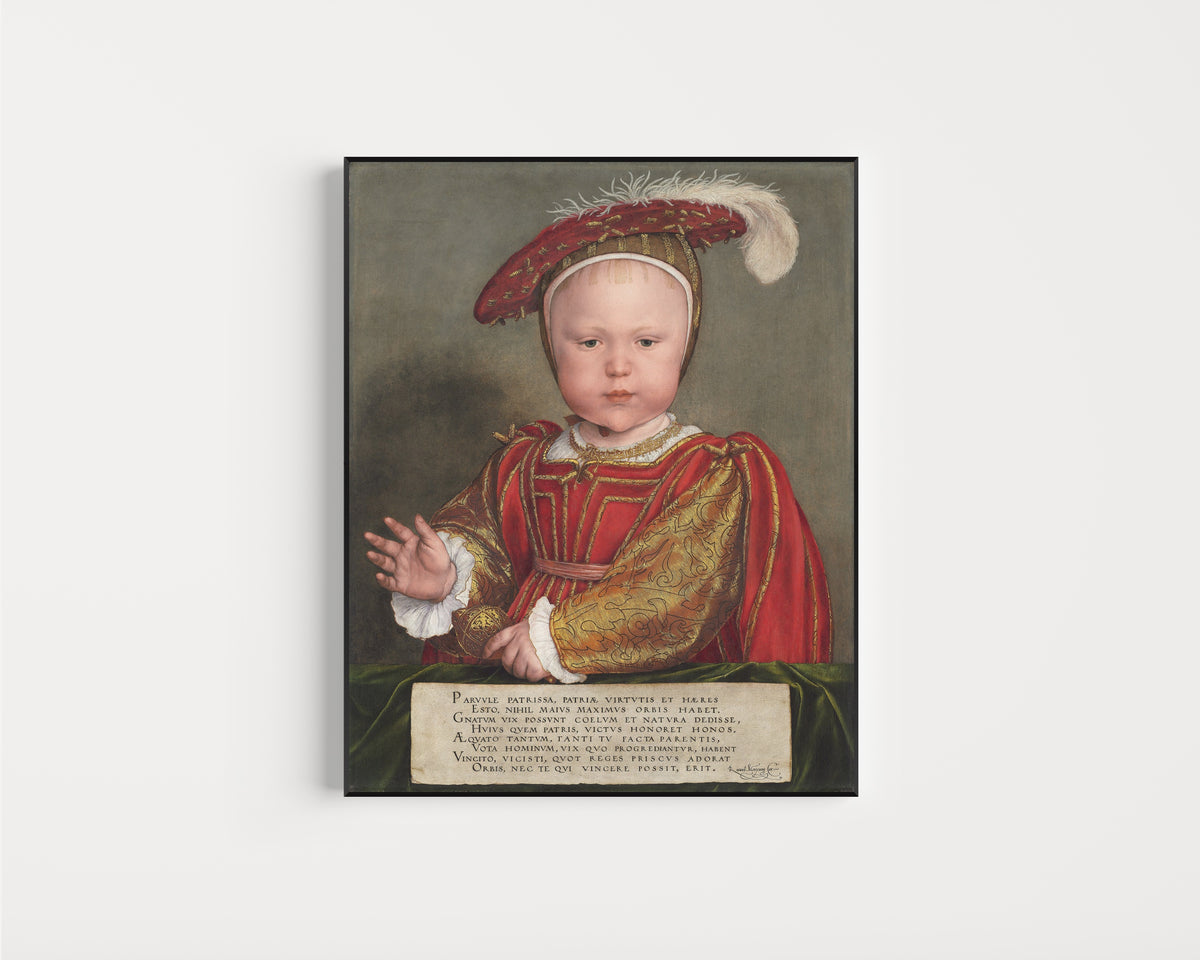 Framed art print of Edward VI as a Child by Hans Holbein the Younger, in a slim black frame on a plain white wall