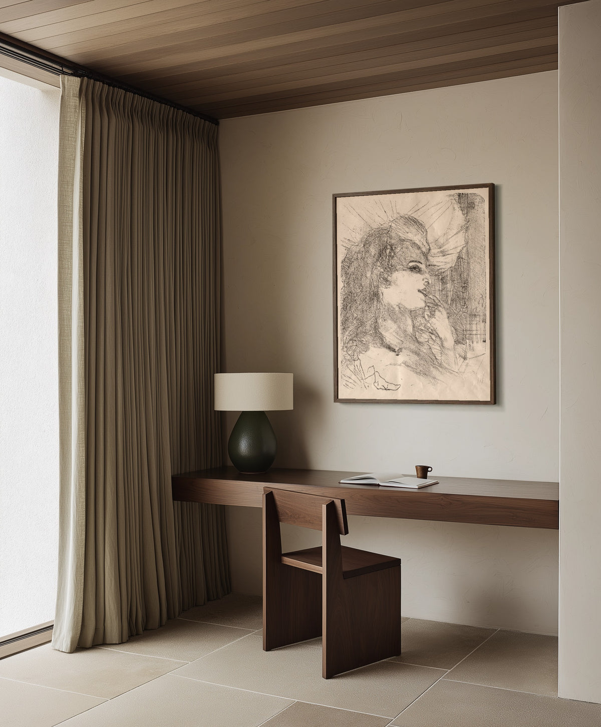 Framed art print of Anna Held by Henri de Toulouse-Lautrec, in a dark wood frame on a plaster wall above a walnut desk