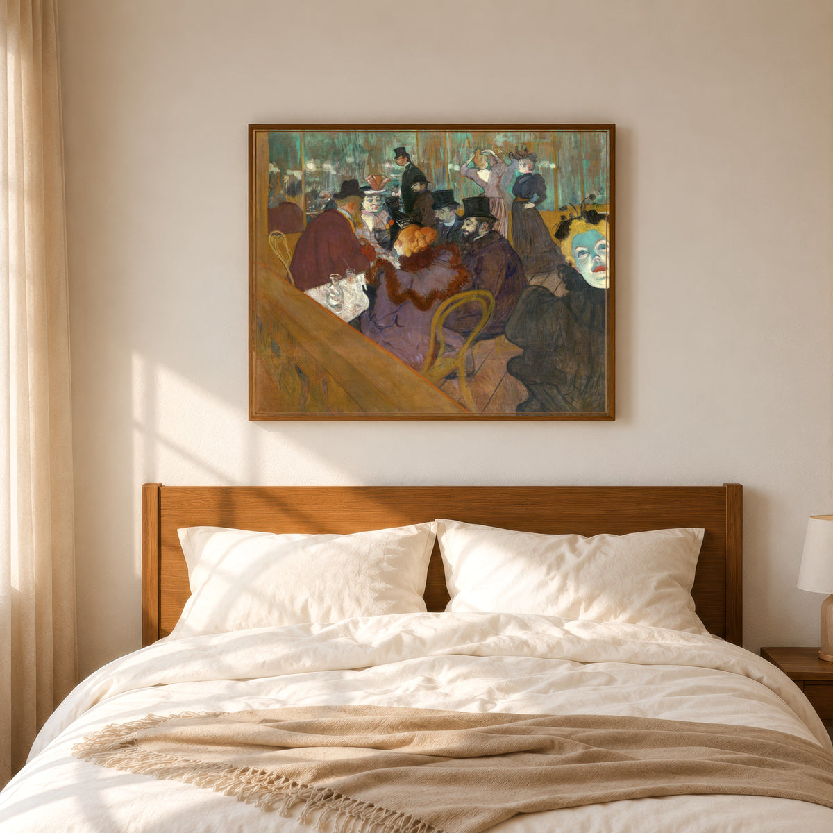 Framed art print of At the Moulin Rouge by Henri de Toulouse-Lautrec, in a slim wood frame above a bed in a sunlit bedroom