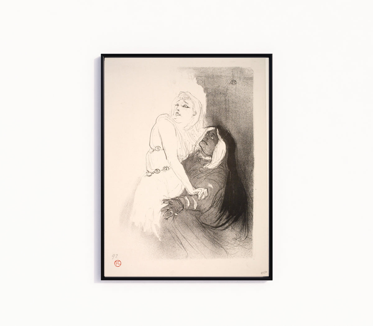 Framed art print of At the Renaissance: Sarah Bernhardt in Phèdre by Henri de Toulouse-Lautrec, in a slim black frame on a plain white wall