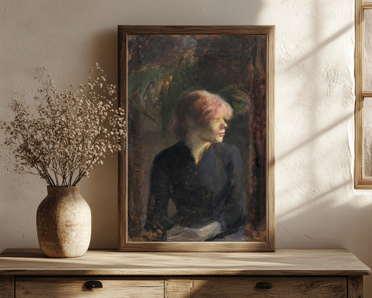 Framed art print of Carmen Gaudin by Henri de Toulouse-Lautrec, in a dark wood frame leaning on a rustic console beside dried flowers