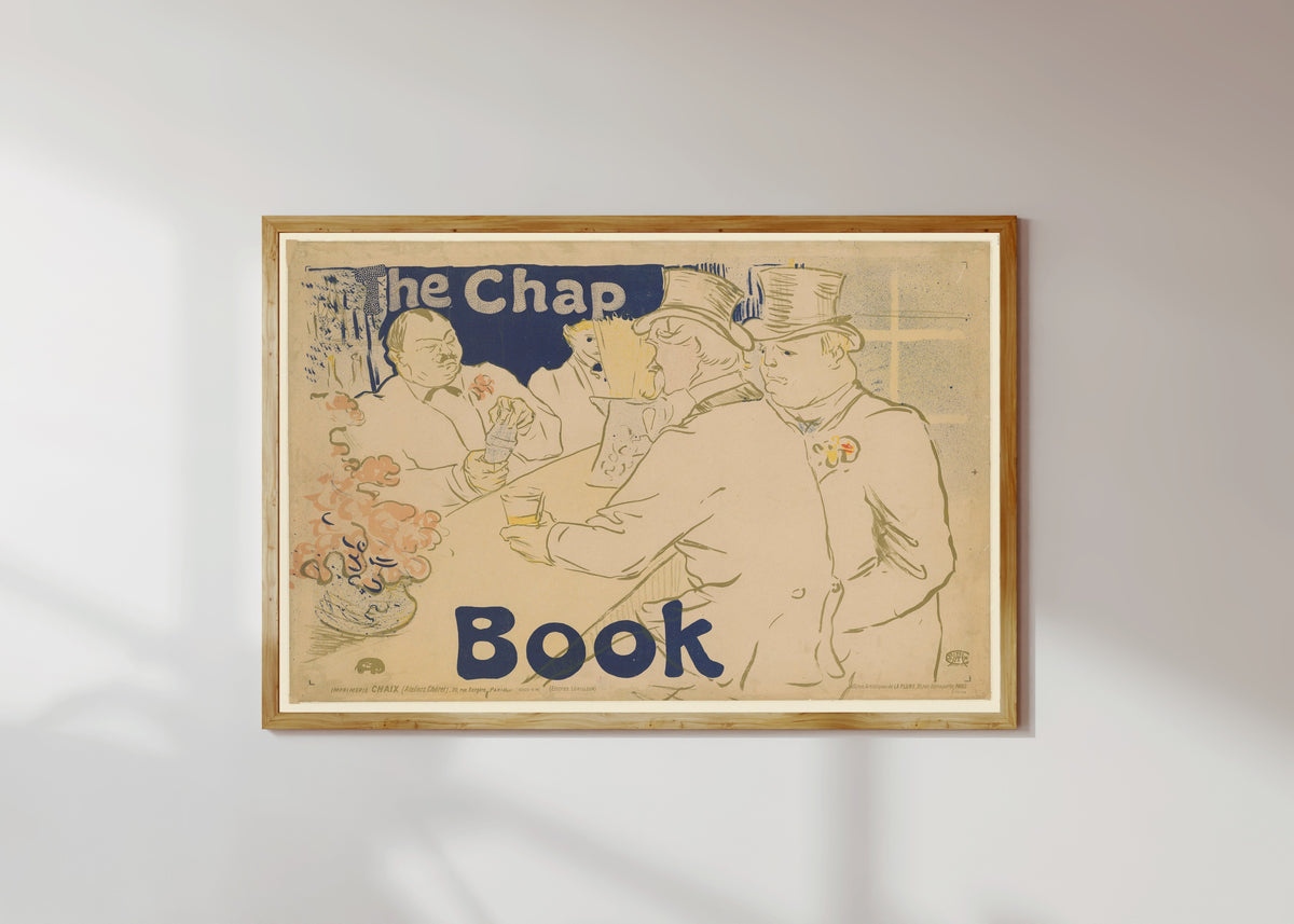 Framed art print of Irish and American Bar, Rue Royale: The Chap Book by Henri de Toulouse-Lautrec, in a light wood frame on a sunlit white wall