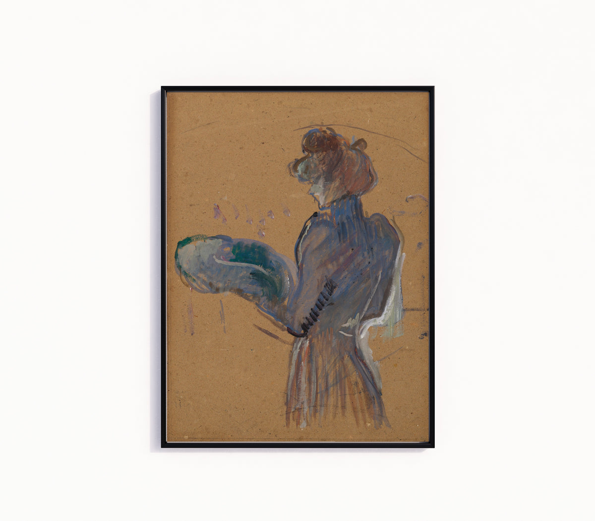 Framed art print of La Modiste, Mademoiselle Margouin by Henri de Toulouse-Lautrec, in a slim black frame on a plain white wall