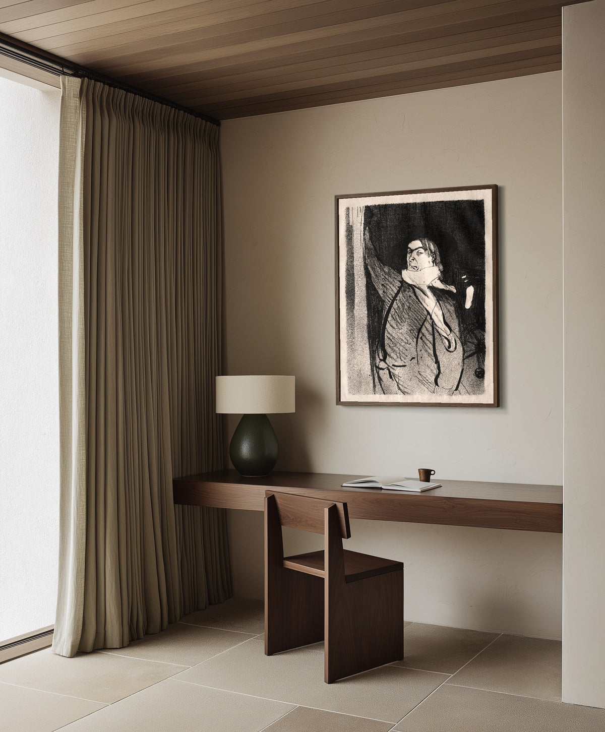 Framed art print of Le Café-Concert: Aristide Bruant by Henri de Toulouse-Lautrec, in a dark wood frame on a plaster wall above a walnut desk