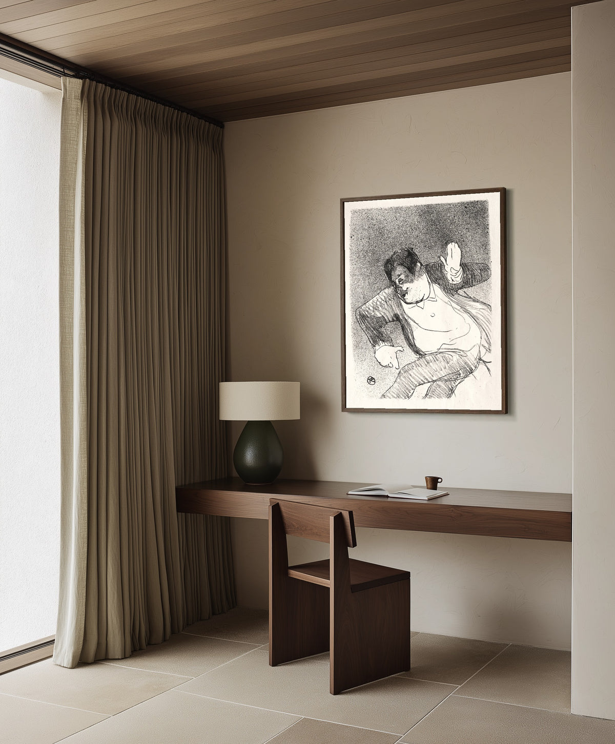 Framed art print of Le Café-Concert: Caudieux by Henri de Toulouse-Lautrec, in a dark wood frame on a plaster wall above a walnut desk