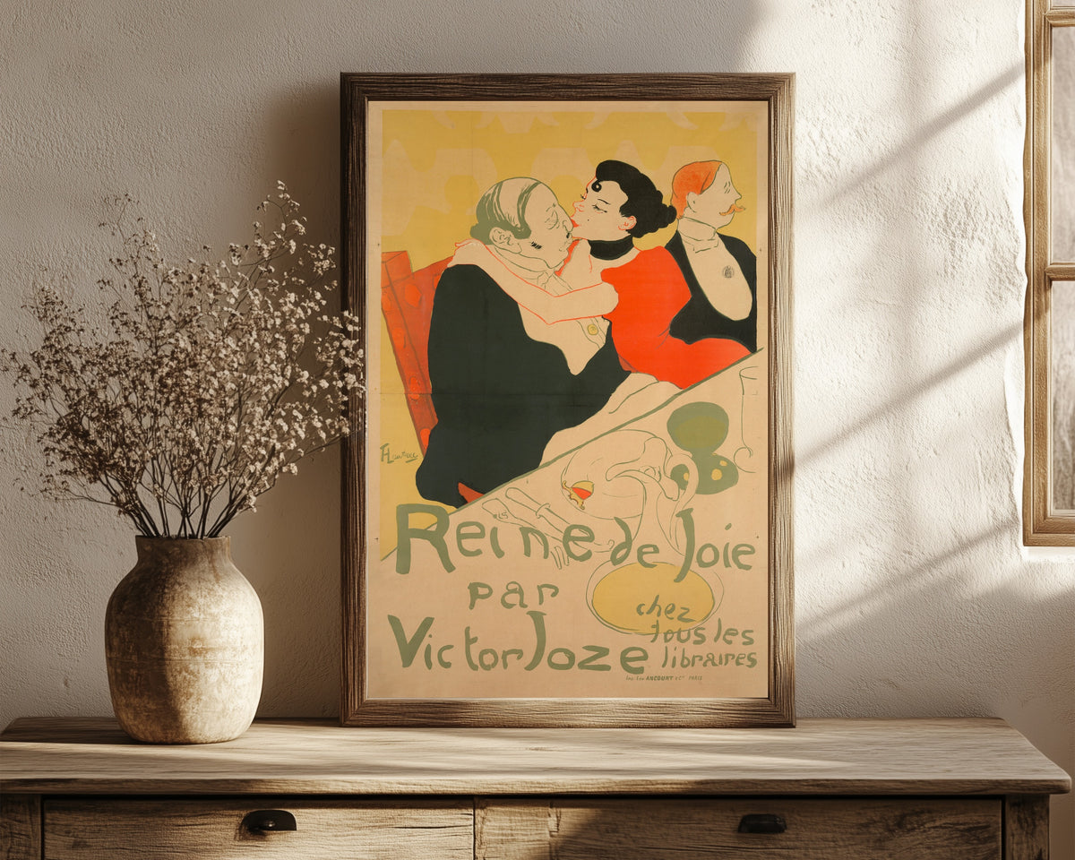 Framed art print of Reine de Joie by Henri de Toulouse-Lautrec, in a dark wood frame leaning on a rustic console beside dried flowers