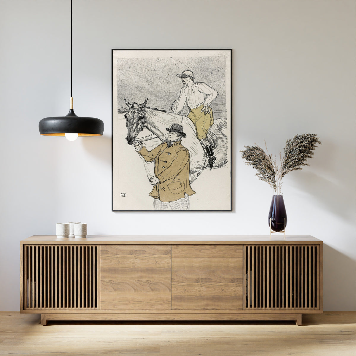 Framed art print of The Jockey Going to the Post by Henri de Toulouse-Lautrec, above a slatted wood sideboard
