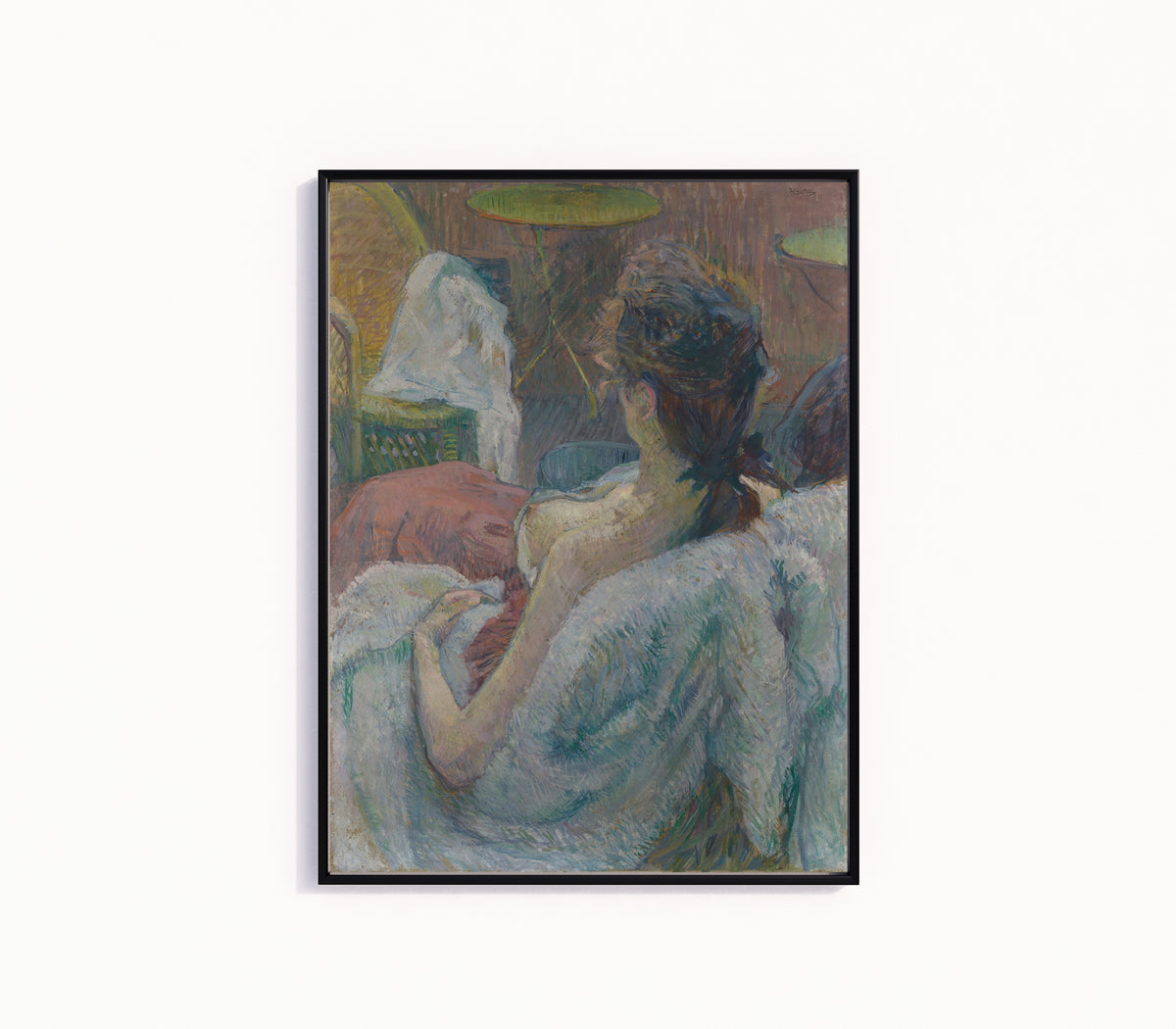Framed art print of The Model Resting by Henri de Toulouse-Lautrec, in a slim black frame on a plain white wall