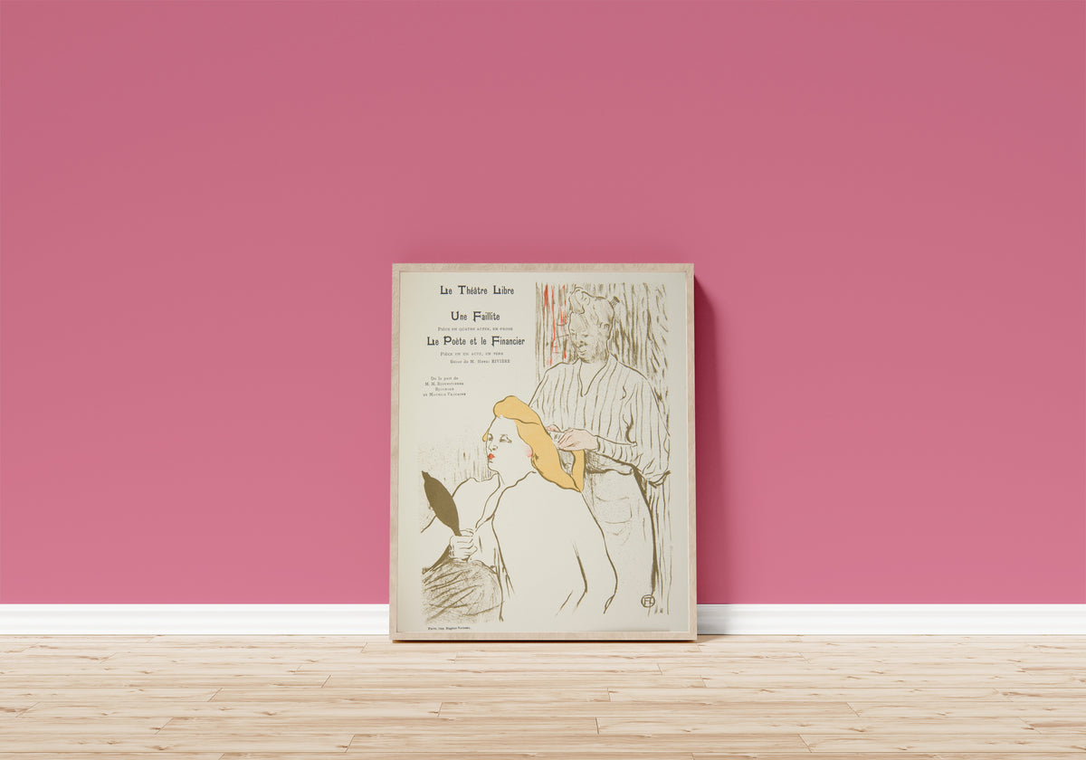 Framed art print of Une Faillite (Théâtre Libre Programme) by Henri de Toulouse-Lautrec, in a light wood frame leaning on a pink wall above a wooden floor