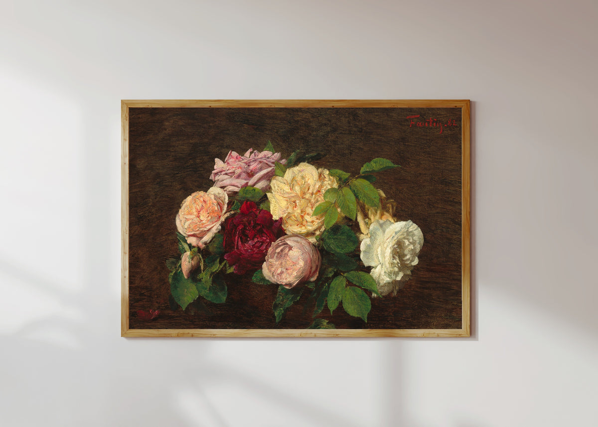 Framed art print of Roses de Nice on a Table by Henri Fantin-Latour, in a light wood frame on a sunlit white wall