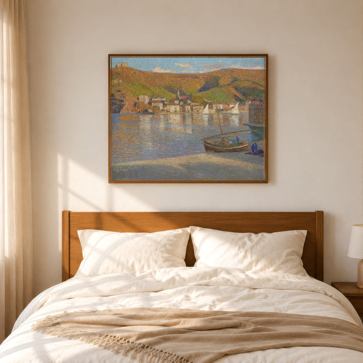Framed art print of Cinq pêcheurs et leur barque échouée sur la grève à Collioure by Henri Martin, in a slim wood frame above a bed in a sunlit bedroom