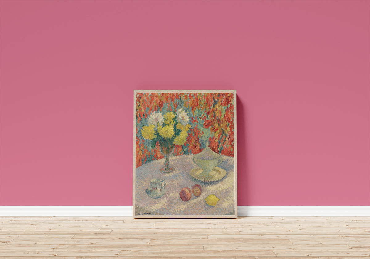 Framed art print of Dahlias au soleil by Henri Martin, in a light wood frame leaning on a pink wall above a wooden floor